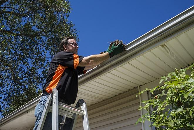 experienced contractor repairing a gutter system in Wapwallopen PA